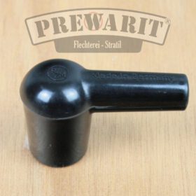 Seitliche Ansicht eines unpolierten Kerzenstecker aus schwarzem Bakelit im Patina Look, der nicht entstört ist.